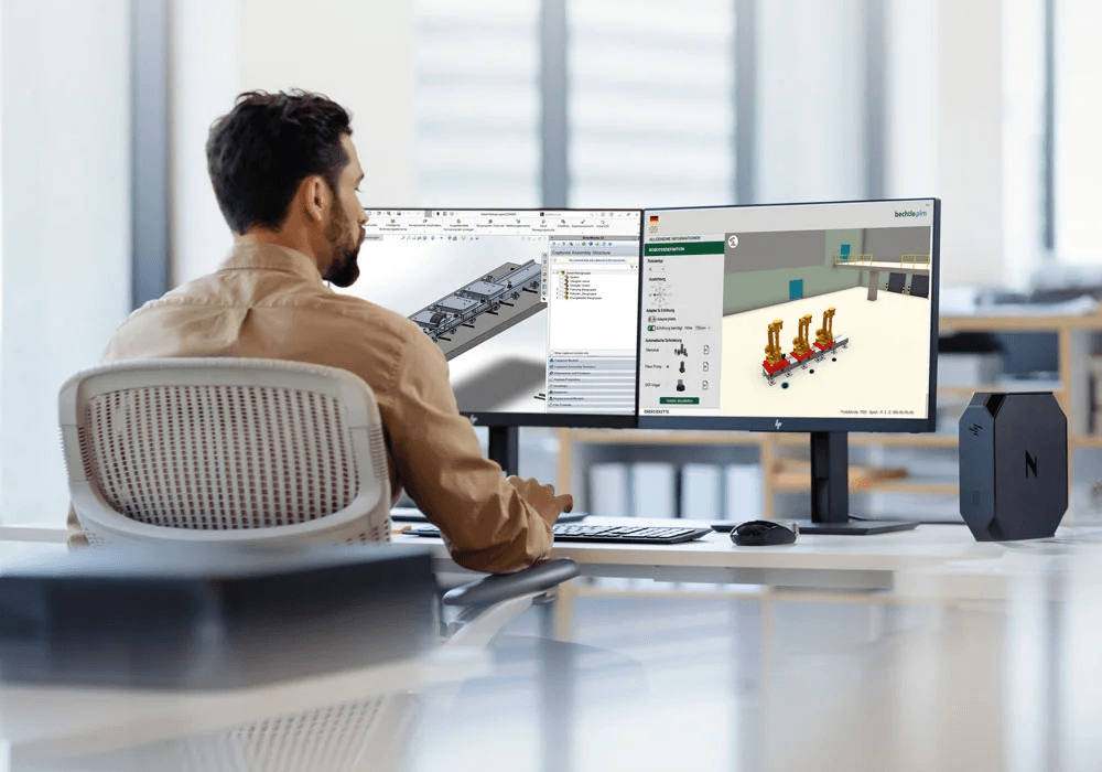 Ein Mann arbeitet an einem CAD-System mit Fokus auf Automatisierungsprozesse